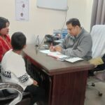 Dr Abhishek - explaining scanning reports to the patient