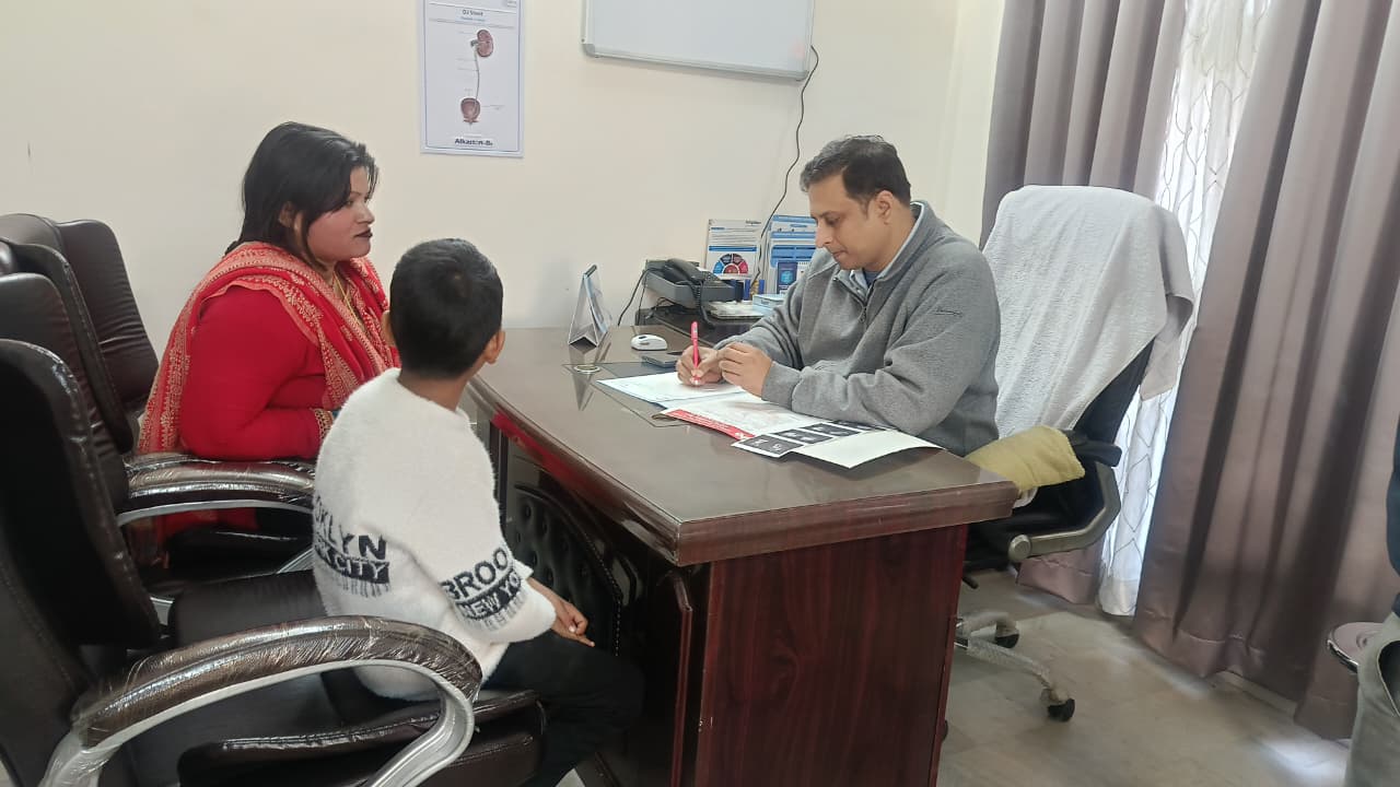 Dr Abhishek - explaining scanning reports to the patient